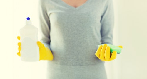 Cleaner preparing a kitchen and bathroom in a Paddington home